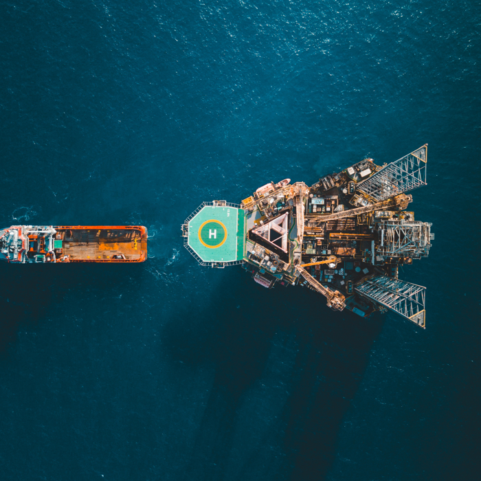 aerial bird eye view of boat and oil gas asset in the ocean