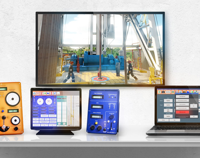 A desk displays a monitor showing an industrial scene, alongside an orange device, a tablet with a blue screen, a blue device with knobs, and a laptop with a grid interface.