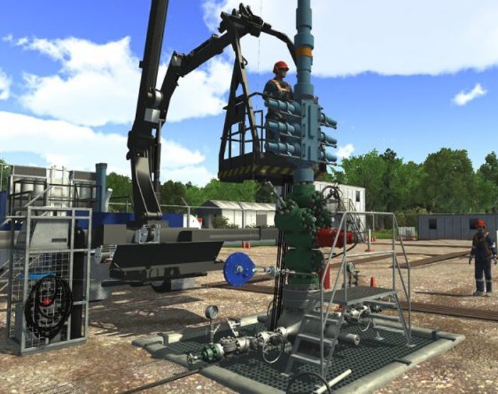 Workers operate machinery at an outdoor industrial site with various equipment and structures, surrounded by trees under a partly cloudy sky.